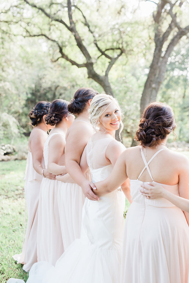 unique bride photo with bridesmaids - blush wedding in October in Texas