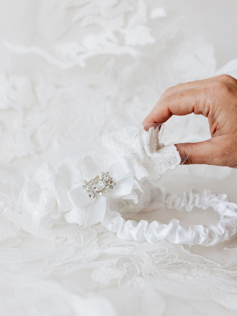 custom wedding garter set heirlooms with sparkle and tulle material from bride's wedding dress handmade by The Garter Girl