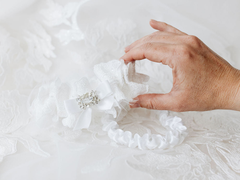 custom wedding garter set heirlooms with sparkle and tulle material from bride's wedding dress handmade by The Garter Girl