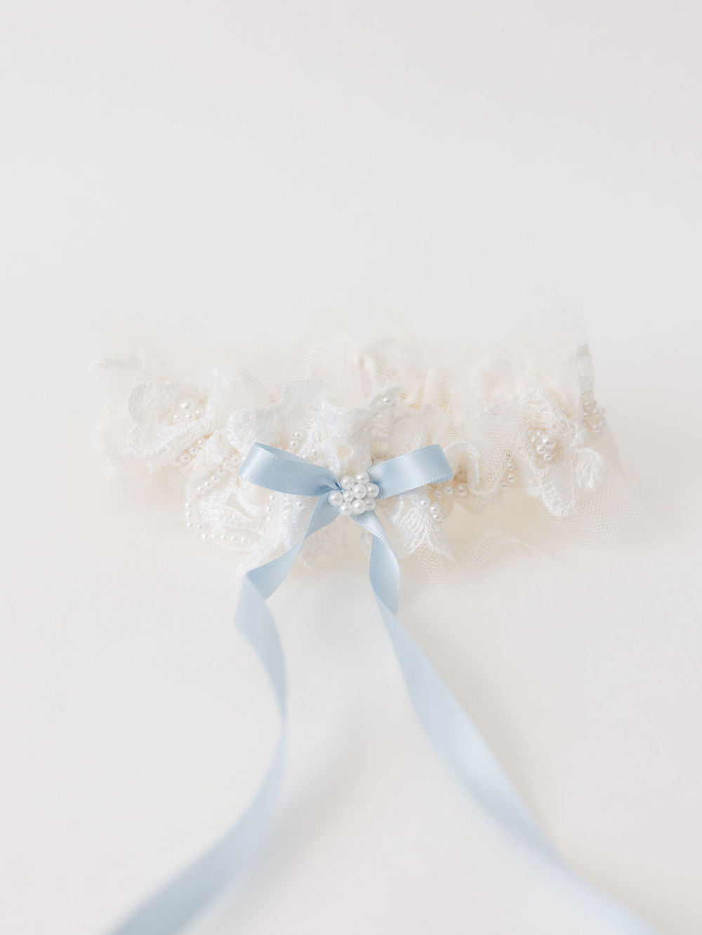 wedding garter heirloom with long blue center bow created from mom's wedding dress handcrafted by The Garter Girl