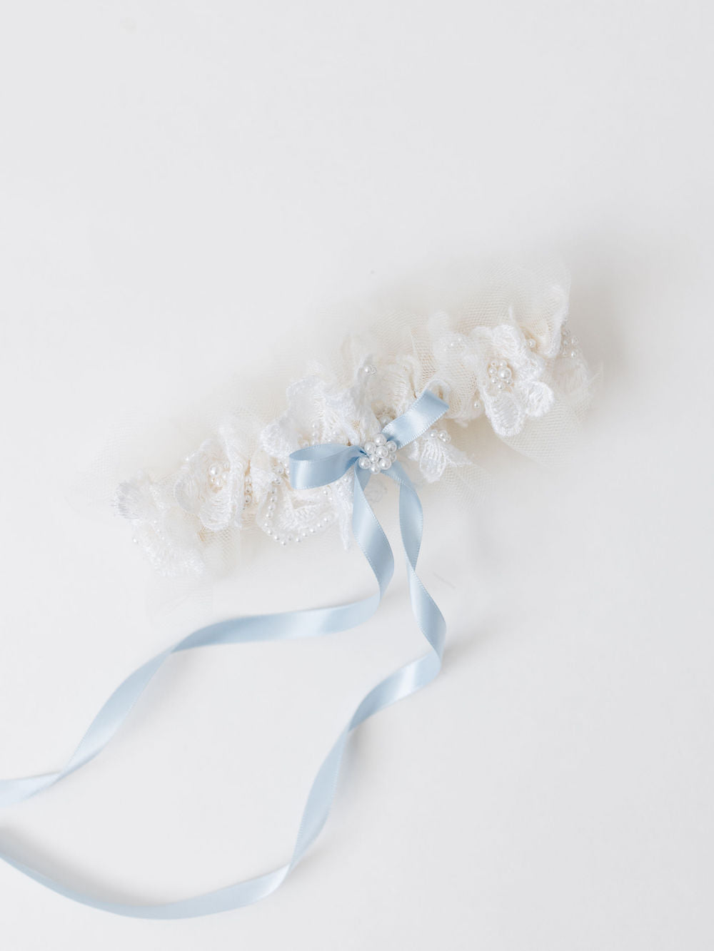 wedding garter heirloom with long blue center bow created from mom's wedding dress handcrafted by The Garter Girl