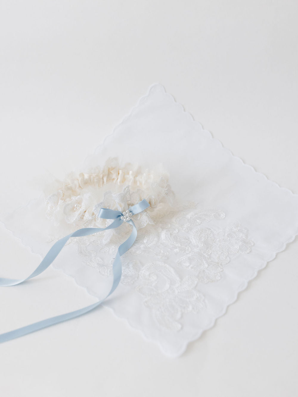 wedding garter heirloom with long blue center bow created from mom's wedding dress handcrafted by The Garter Girl
