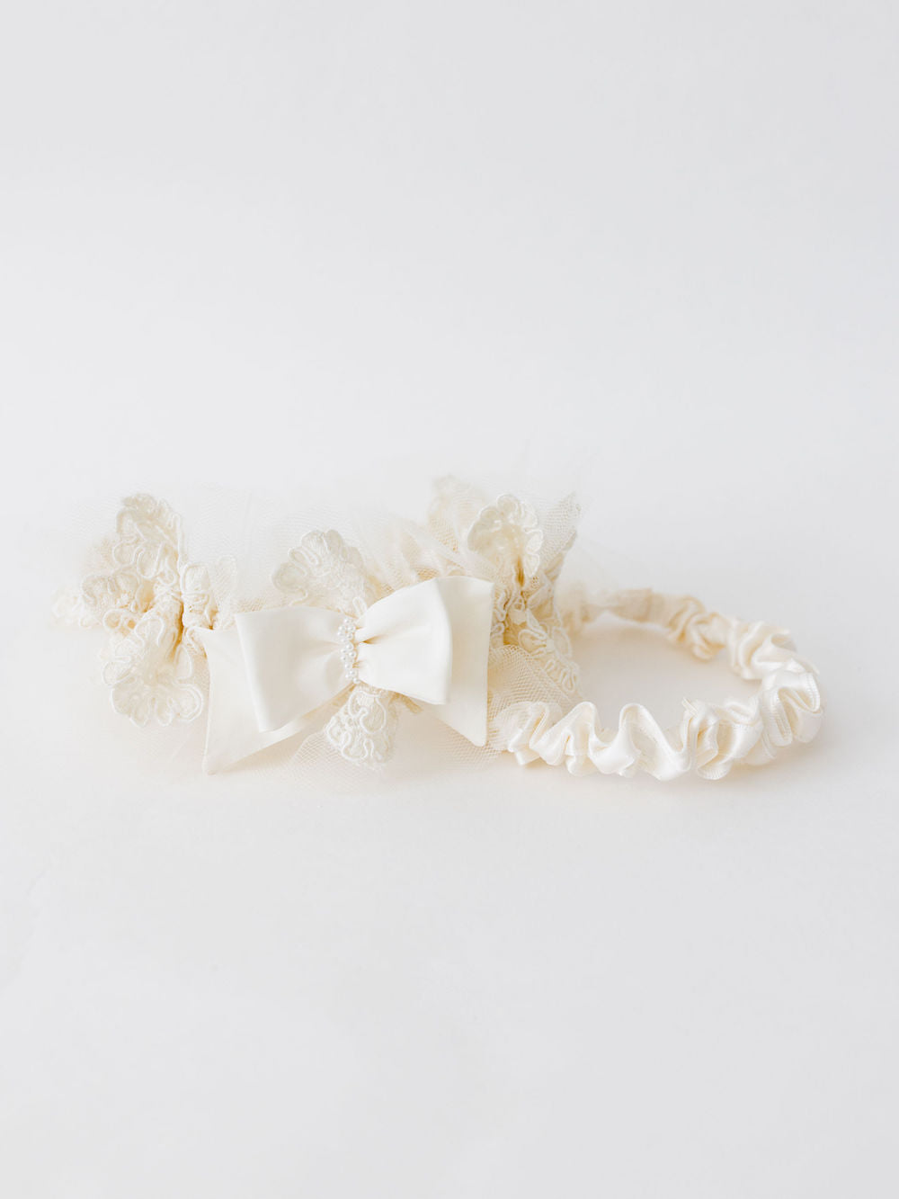 custom garter with ivory lace and pearls from grandmother's lace wedding dress and pearls by The Garter Girl