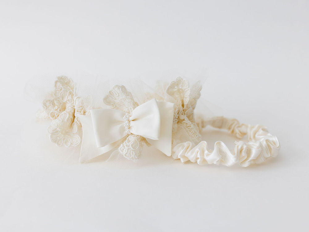 custom garter set with ivory lace main garter and satin tossing garter made from grandmother's lace wedding dress and pearls by The Garter Girl