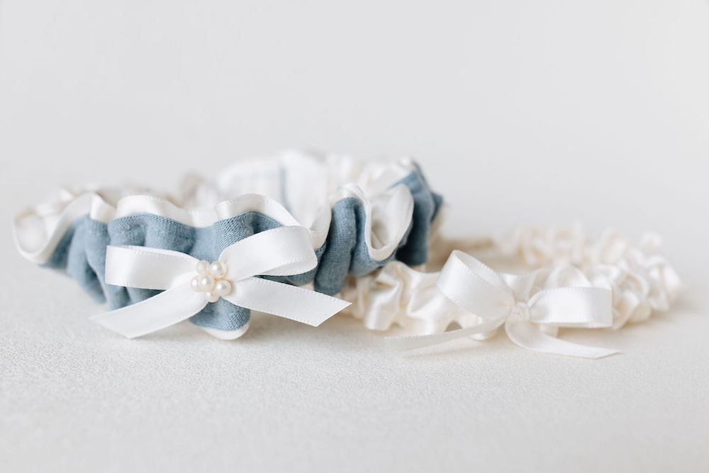 custom garter set with ivory satin tossing garter and ivory tulle and pearls main garter with blue stripe from dad's t-shirt handmade by The Garter Girl