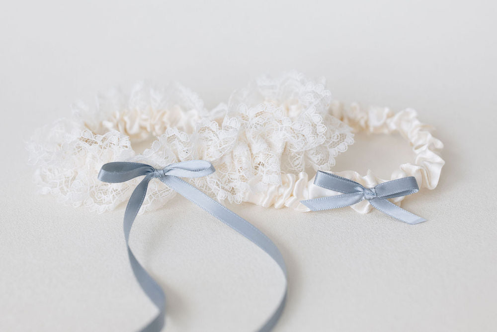 stunning custom ivory lace garter heirloom with something blue ribbon detailing handmade by The Garter Girl