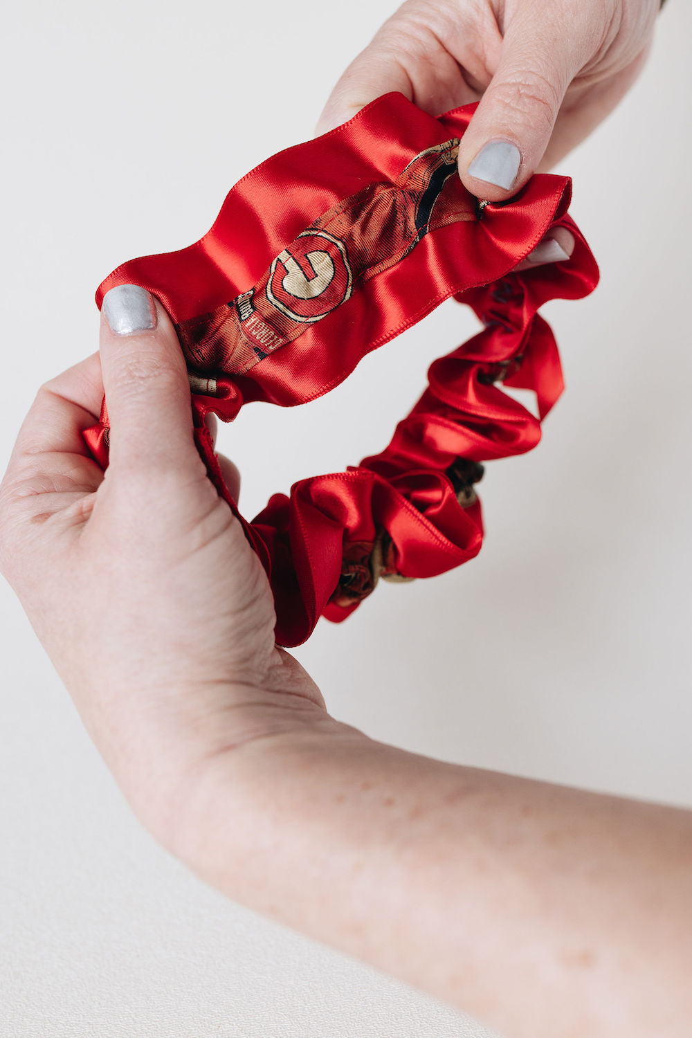 detailing on handmade main garter from wedding garter set crafted from father's tie by The Garter Girl