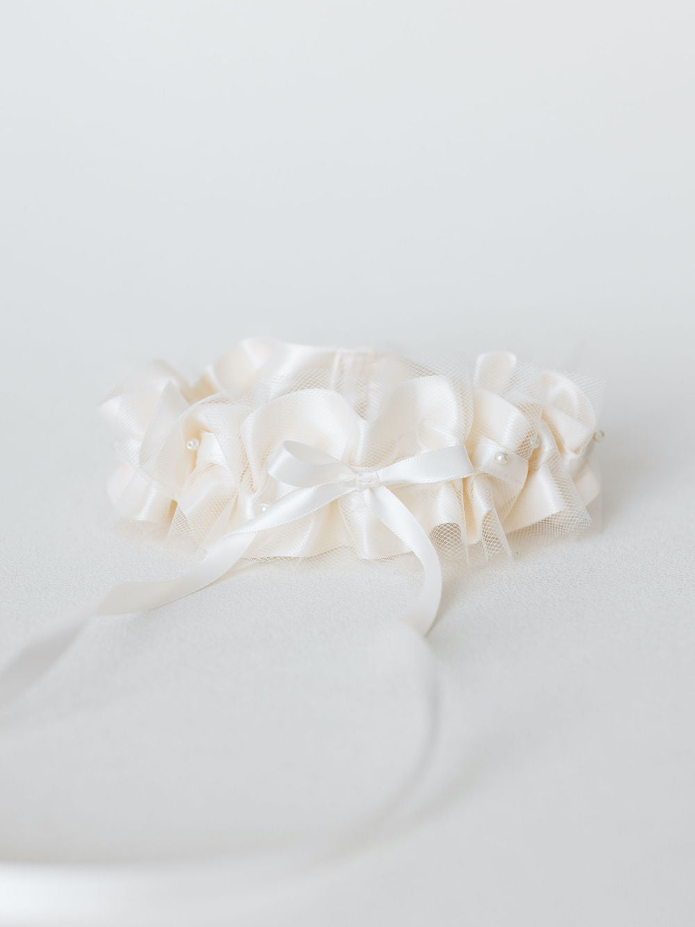 wedding garter in ivory handmade with tulle and pearls by The Garter Girl