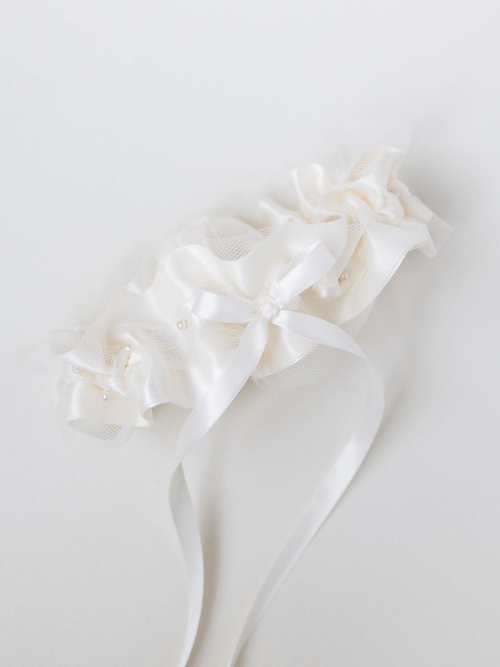 custom ivory tulle wedding garter heirloom with personalized embroidery handmade by The Garter Girl