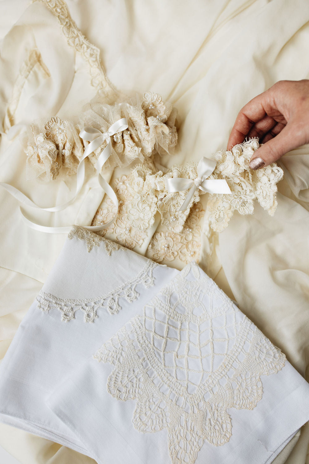 Custom wedding garters and handkerchiefs made from the bride's mothers wedding dress lace by The Garter Girl