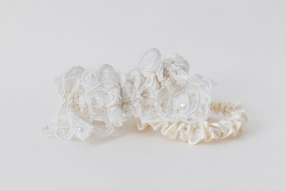 custom garter set with ivory lace main garter and ivory satin tossing garter made from hem of mom's wedding dress handmade by The Garter Girl