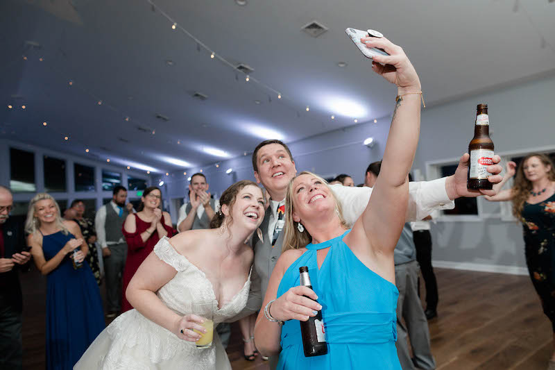 Enjoying Reception Selfie with guest