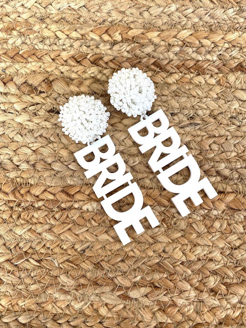 https://cdn.shopify.com/s/files/1/0019/9878/2525/files/fun-bride-earrings-bachelorette-party-gift.jpg?v=1625075761