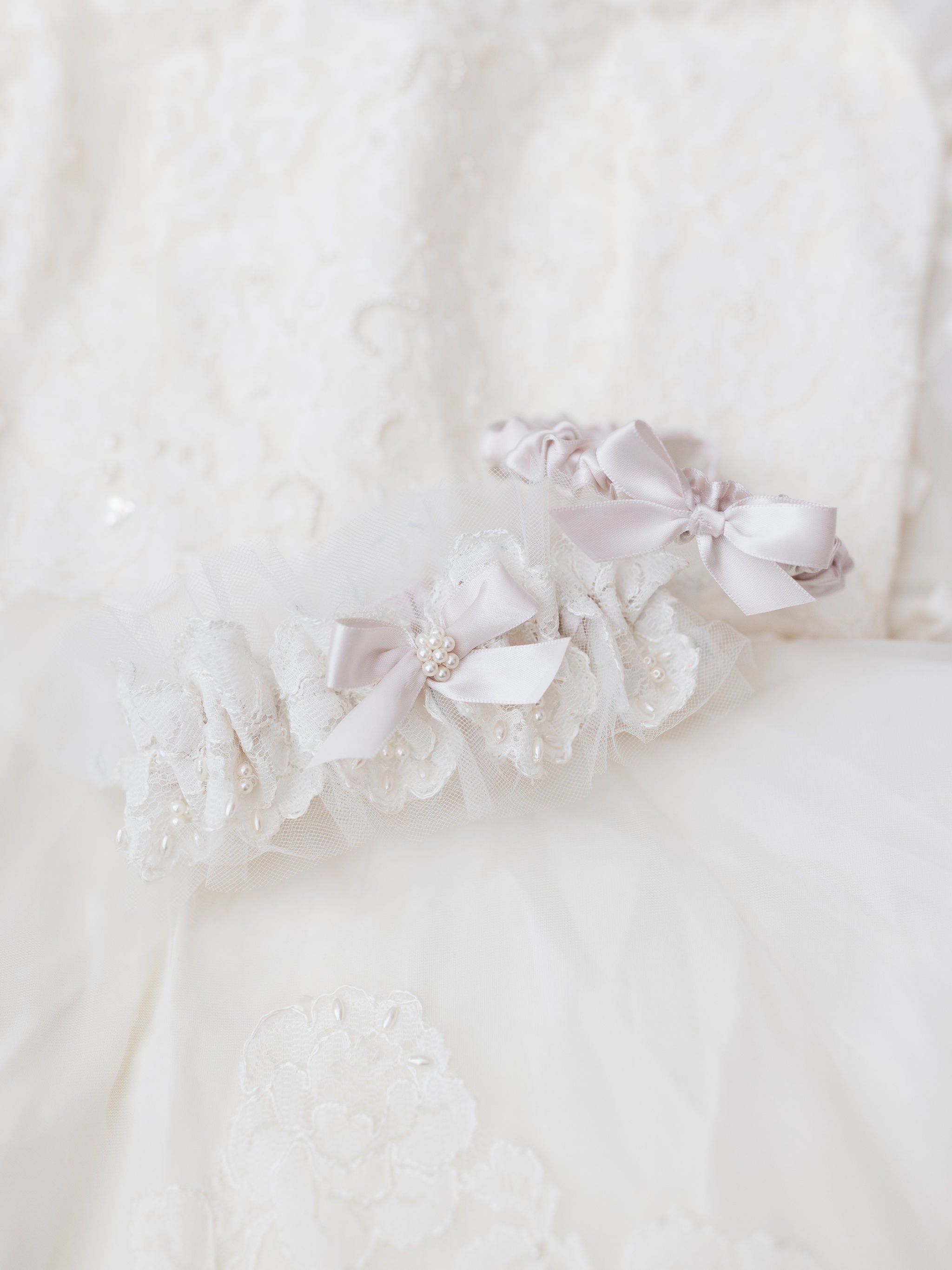 wedding garter set made from mothers wedding dress with pearls, lace, blush accents and personalized embroidery - a handmade wedding heirloom by The Garter Girl