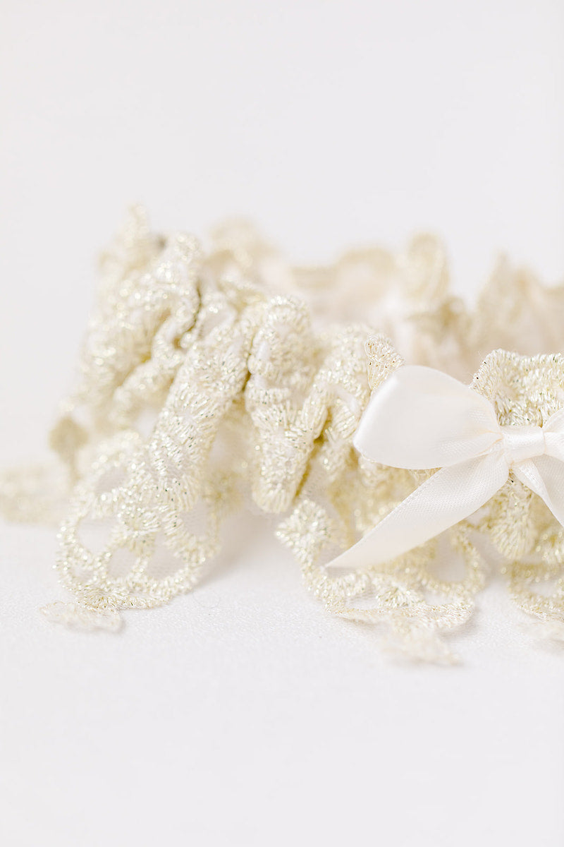 custom heirloom garter with gold lace and ivory satin