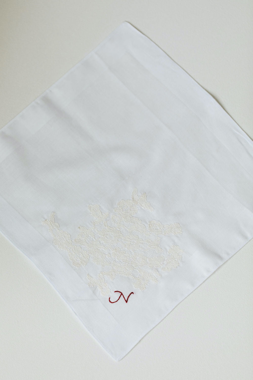 using great grandmother's wedding dress lace on two wedding handkerchiefs personalized with monogram embroidery - handmade wedding heirlooms from The Garter Girl