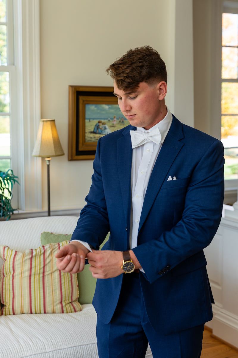 Groom Getting Ready in Blue Suit