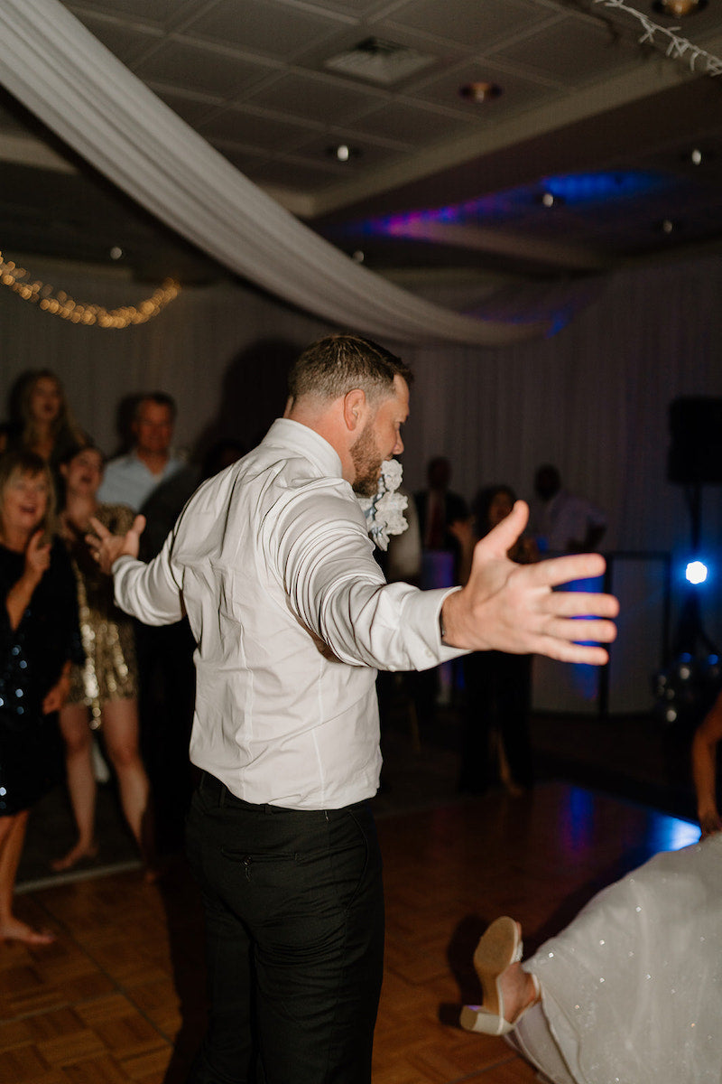 Groom with Garter Toss New Years Wedding