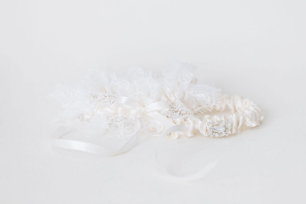 wedding garter set with ivory satin, lace, and diamond emblem