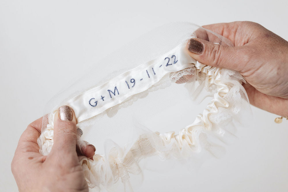 personalized hand embroidered wedding date on tulle and lace wedding garter set handmade by The Garter Girl