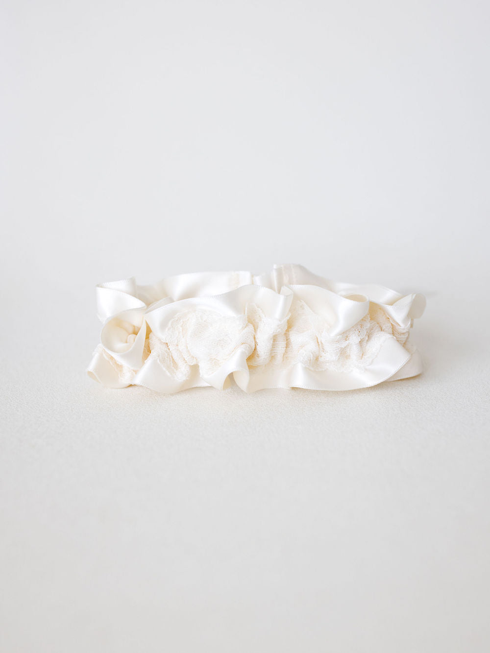 handmade adjustable ivory lace wedding garter created by The Garter Girl