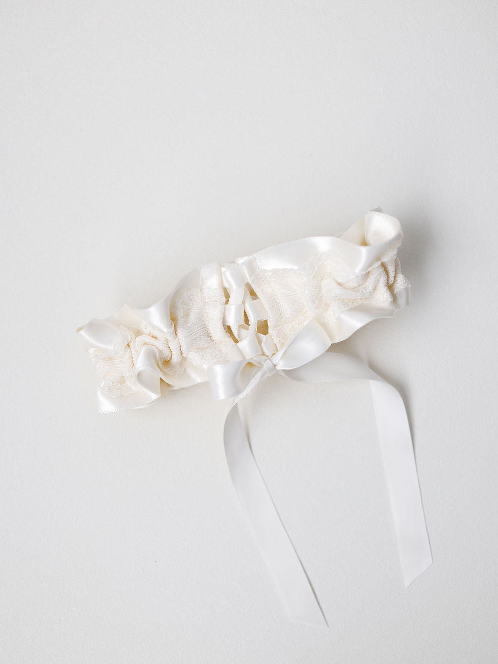 adjustable ivory lace wedding garter with corset tie handmade by The Garter Girl