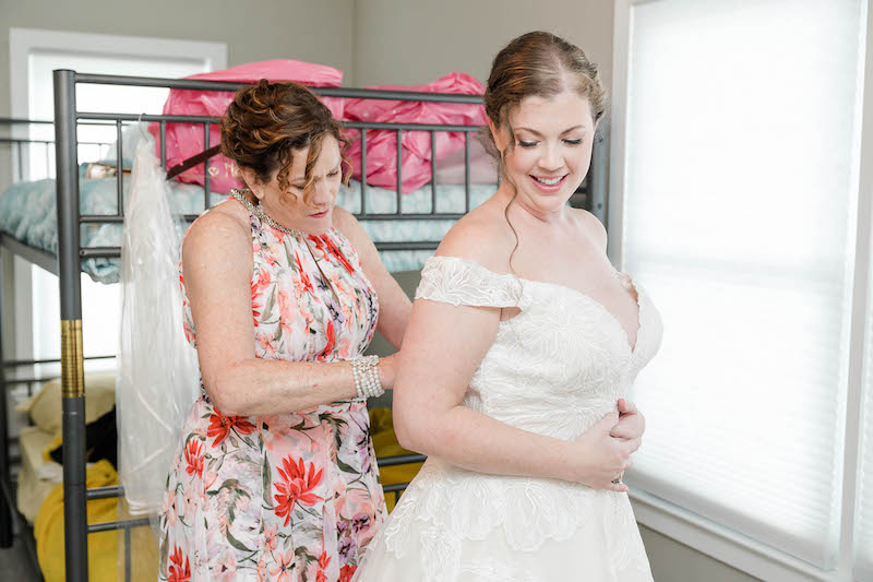 Mom Helping Bride Get Dressed