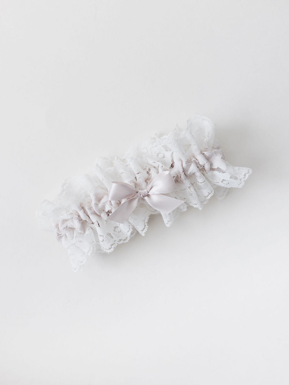 custom wedding garter heirloom with ivory lace and a blush pink satin bow handmade by The Garter Girl