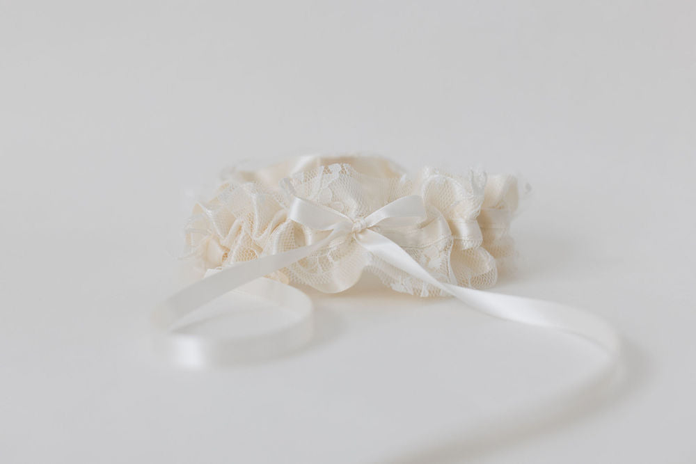 ivory satin wedding garter with lace overlay and special hand-embroidered patch inside handcrafted by wedding expert The Garter Girl