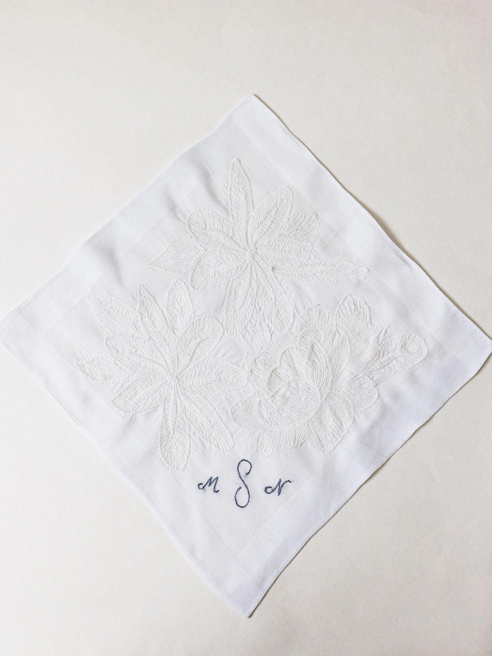 handkerchief heirloom from grandmother's wedding dress with blue monogrammed embroidery handmade by wedding expert The Garter Girl