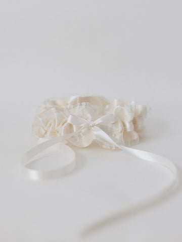 ivory satin wedding garter with lace overlay and special hand-embroidered patch inside handcrafted by wedding expert The Garter Girl