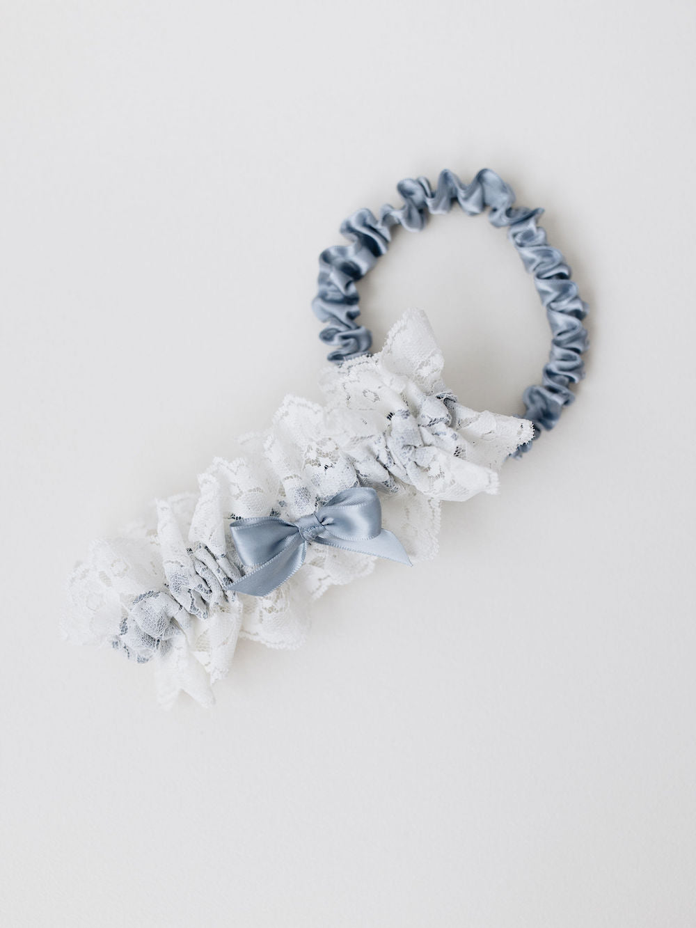 garter set with ivory lace main and blue satin tossing garters handmade by The Garter Girl