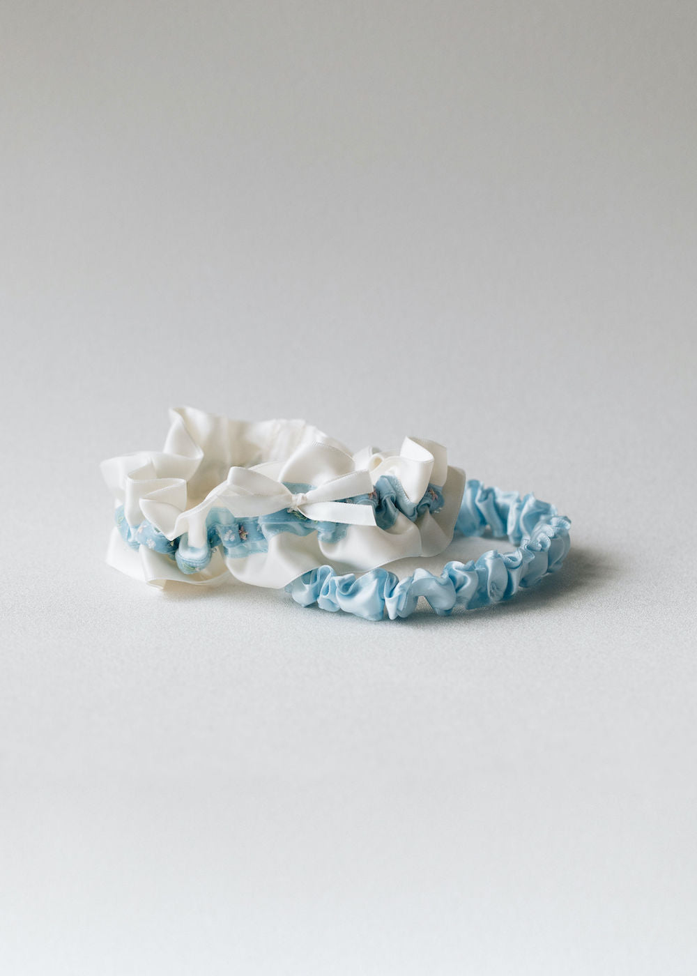 Custom wedding garter set with light blue velvet & beads with personalized embroidery handmade heirloom by The Garter Girl