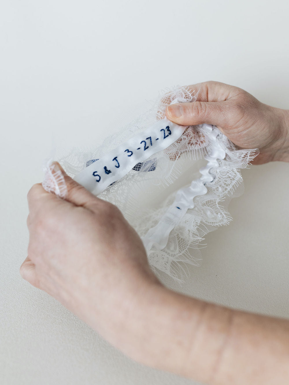 embroidered wedding garter heirloom with tulle and royal blue details handmade by The Garter Girl