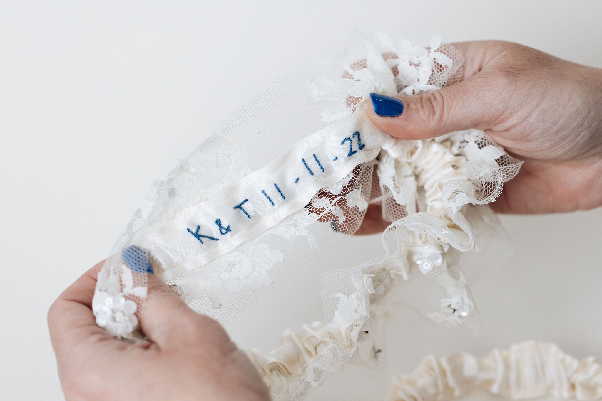 wedding garter set with ivory satin, lace, and sparkles with personalized embroidery - a handmade wedding heirloom by The Garter Girl