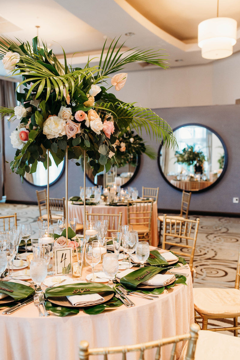 Tall Floral Centerpieces and Personalized Place Settings at Elegant Tropical Wedding