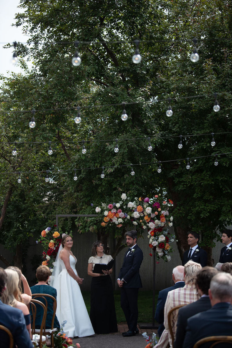 Wedding Ceremony Bright Flowers Bride and Groom Vows