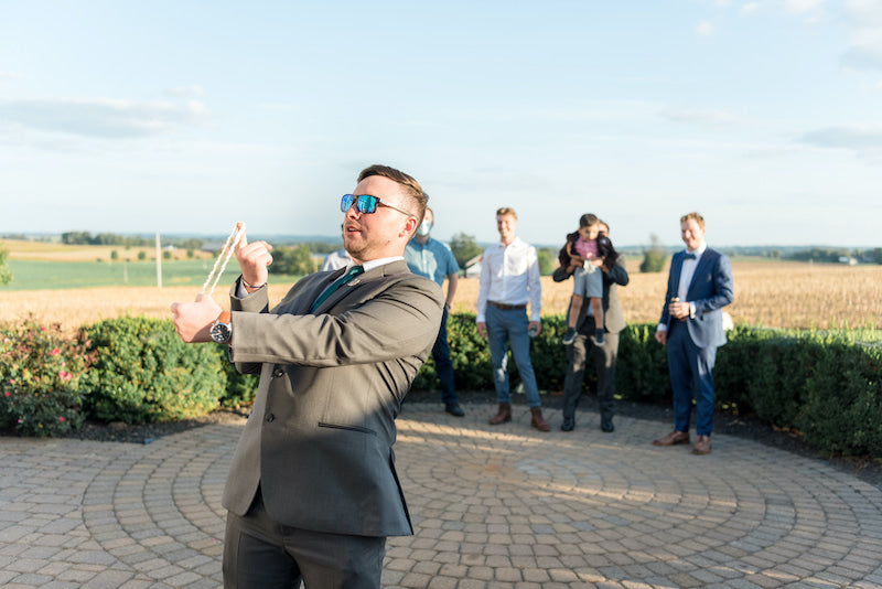 Wedding Garter Toss at Outdoor Wedding