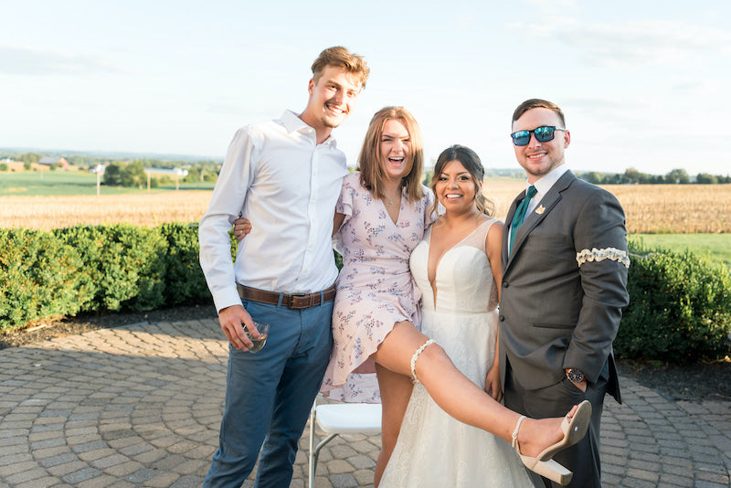 Wedding Guests Garter Toss with Bride and Groom