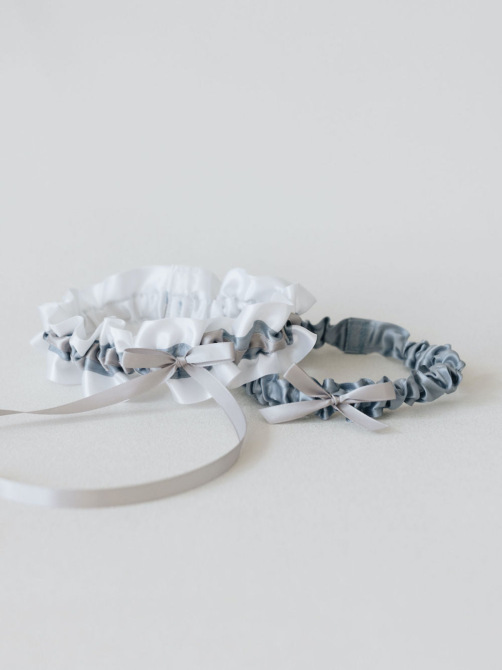 personalized wedding garter set with white, gray & dusty blue handmade by heirloom bridal accessory designer, The Garter Girl