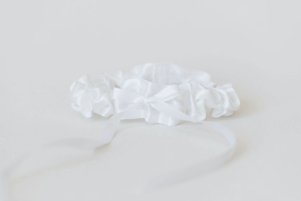 classic white satin wedding garter with something blue personalized embroidery by expert wedding accessories designer, The Garter Girl