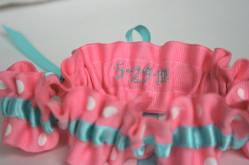 pink and teal wedding garter with date on inside