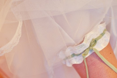 real-white-and-sage-wedding-garter-vanessa-joy-photography