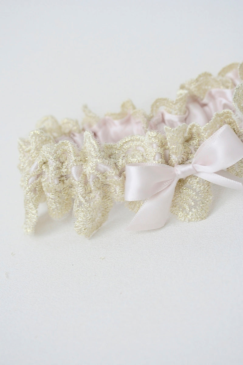 gold lace wedding garter with blush pink satin