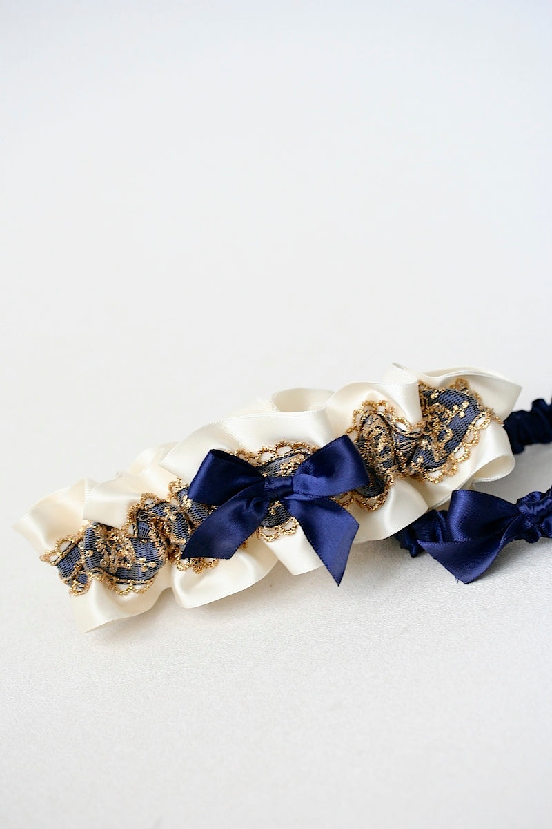 gold lace and navy blue wedding garter set