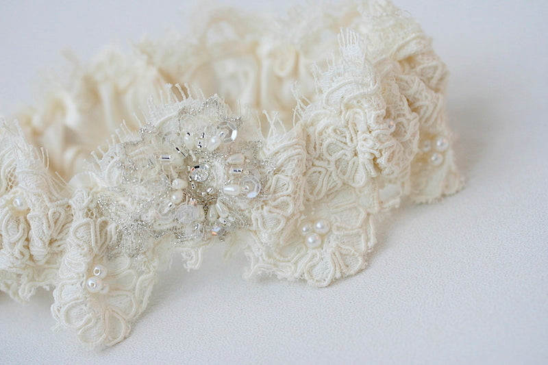 garter with lace taken from mother's wedding dress