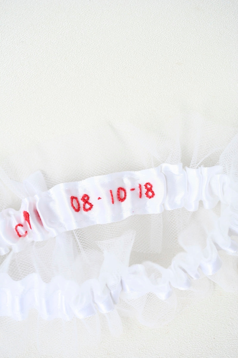 white tulle custom wedding garter with personalized embroidery in red