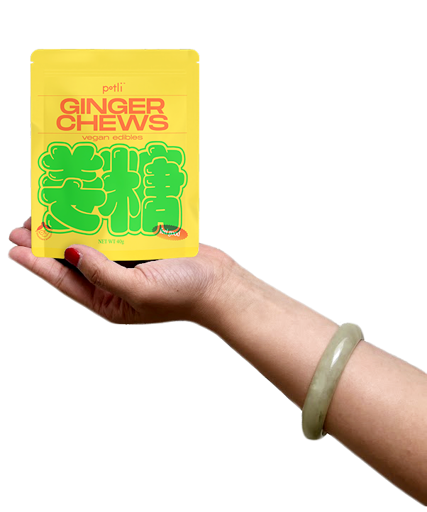 Hand holding a package of 'Potli Ginger Chews,' labeled as vegan edibles.