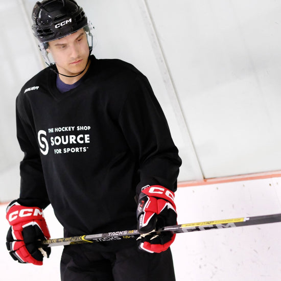 hockey player looking at his AS-V Pro hockey stick