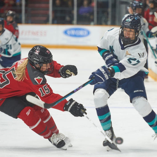 Jade Downie-Landry of PWHL New York pressured by Savannah Harmon of PWHL Ottawa, 2024 New York vs Ottawa Game